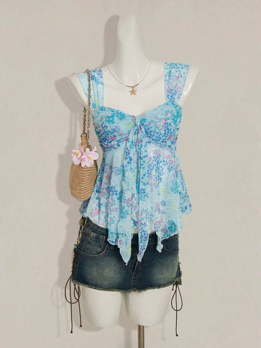 Women's white cherry print cami top with wide straps, ruched knot detail, and an asymmetrical hem