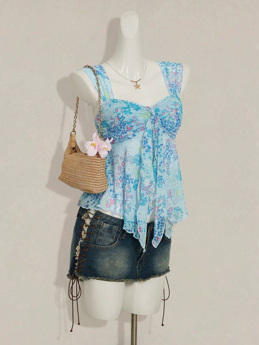 Women's white cherry print cami top with wide straps, ruched knot detail, and an asymmetrical hem