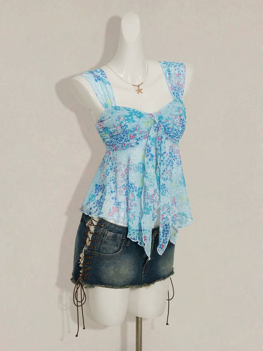 Women's white cherry print cami top with wide straps, ruched knot detail, and an asymmetrical hem