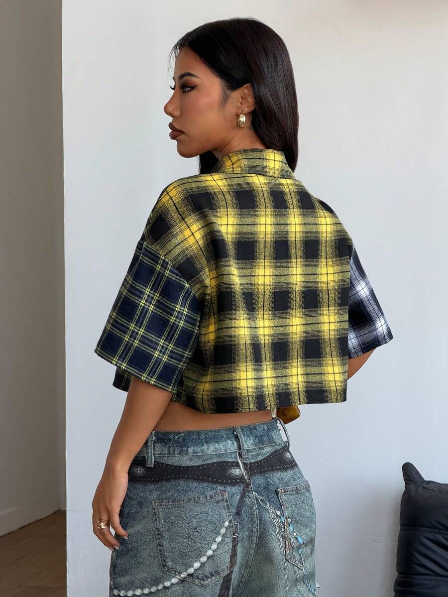 Women's plaid crop shirt with button front, chest pocket, short sleeves, and loose casual fit.