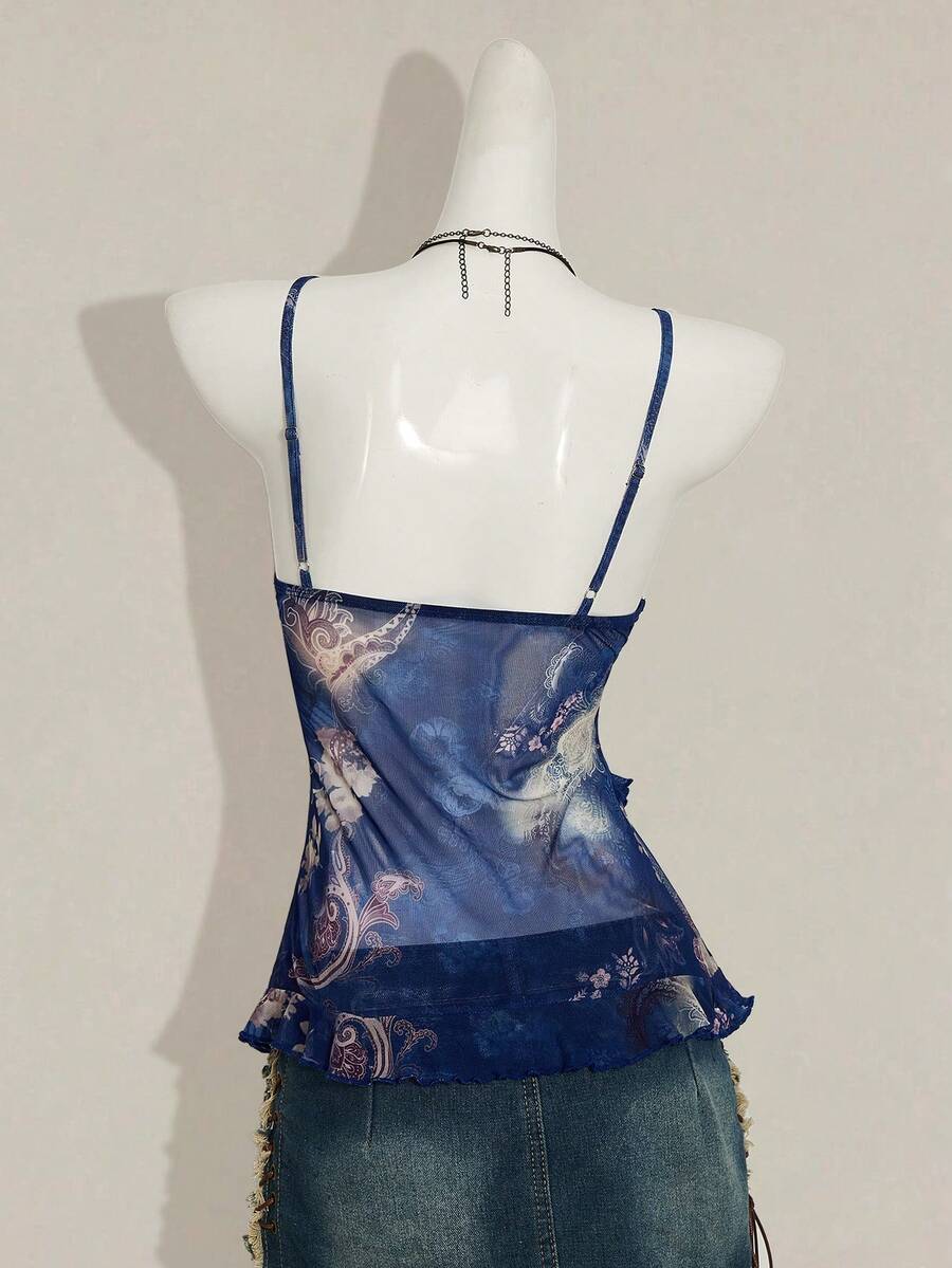 Women's graphic print camisole top featuring thin spaghetti straps, a backless cut, and an asymmetrical hem.