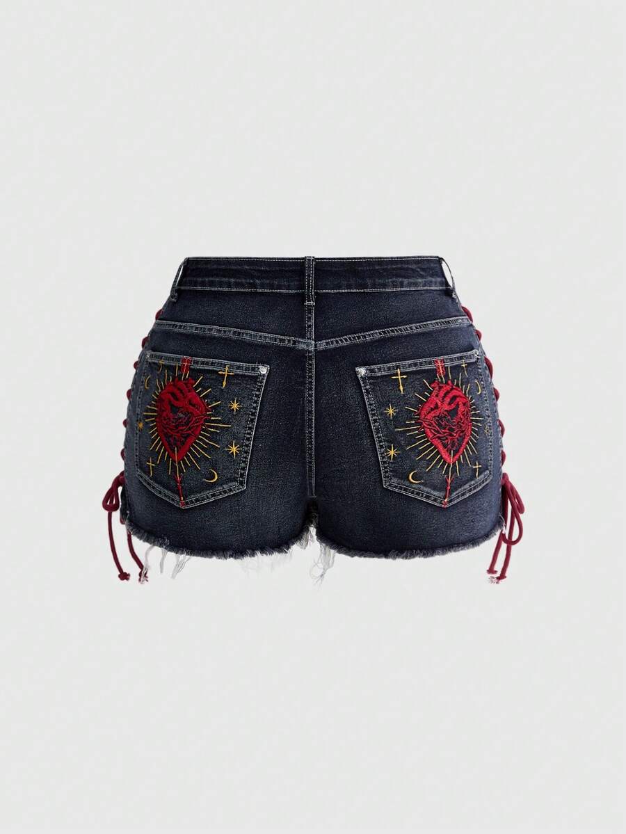 Plus size black gothic mini shorts with heart embroidery, graphic pocket pattern, lace-up detail, raw hem, and zipper fly