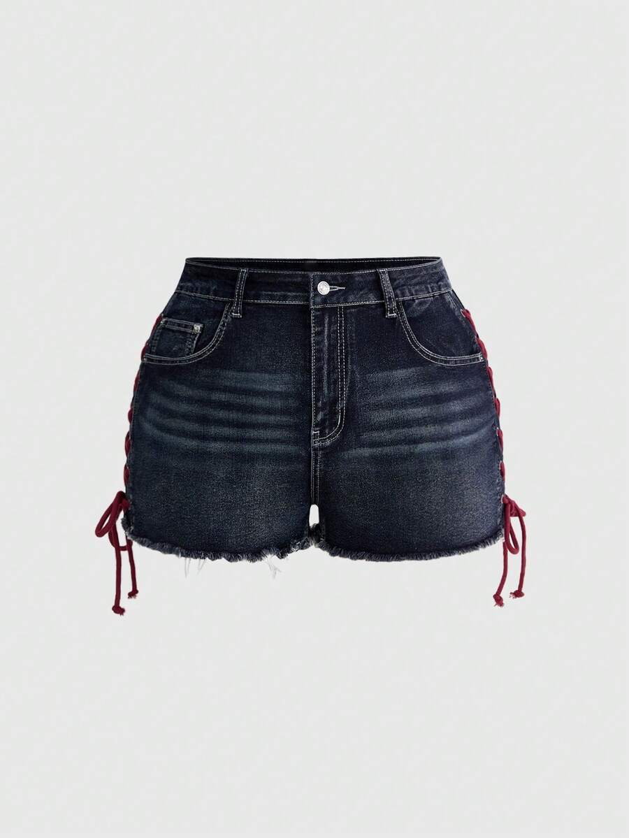 Plus size black gothic mini shorts with heart embroidery, graphic pocket pattern, lace-up detail, raw hem, and zipper fly