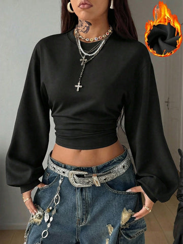 Women's casual black long sleeve knitted pullover sweatshirt featuring a round neck and cinched waist design.