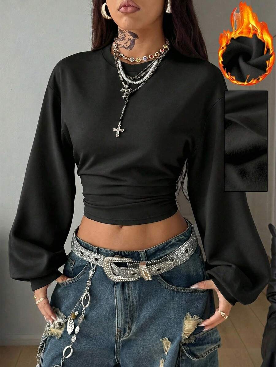 Women's casual black long sleeve knitted pullover sweatshirt featuring a round neck and cinched waist design.