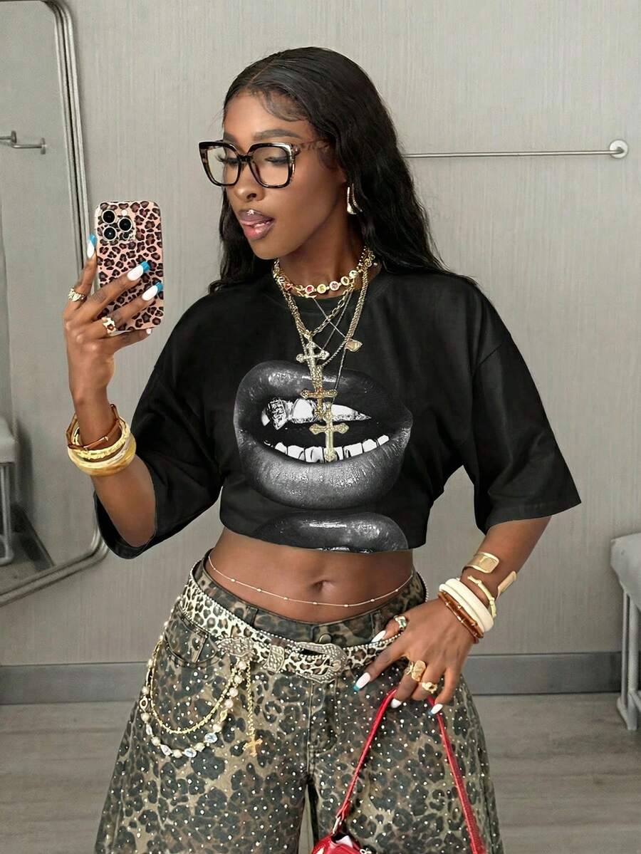 Women's oversized graphic crew neck t-shirt made of 100% white cotton knitted fabric with drop shoulder half sleeves.