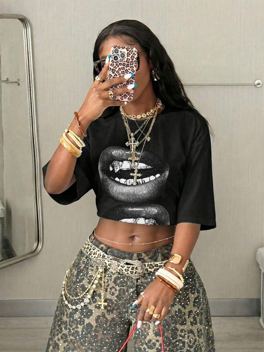 Women's oversized graphic crew neck t-shirt made of 100% white cotton knitted fabric with drop shoulder half sleeves.