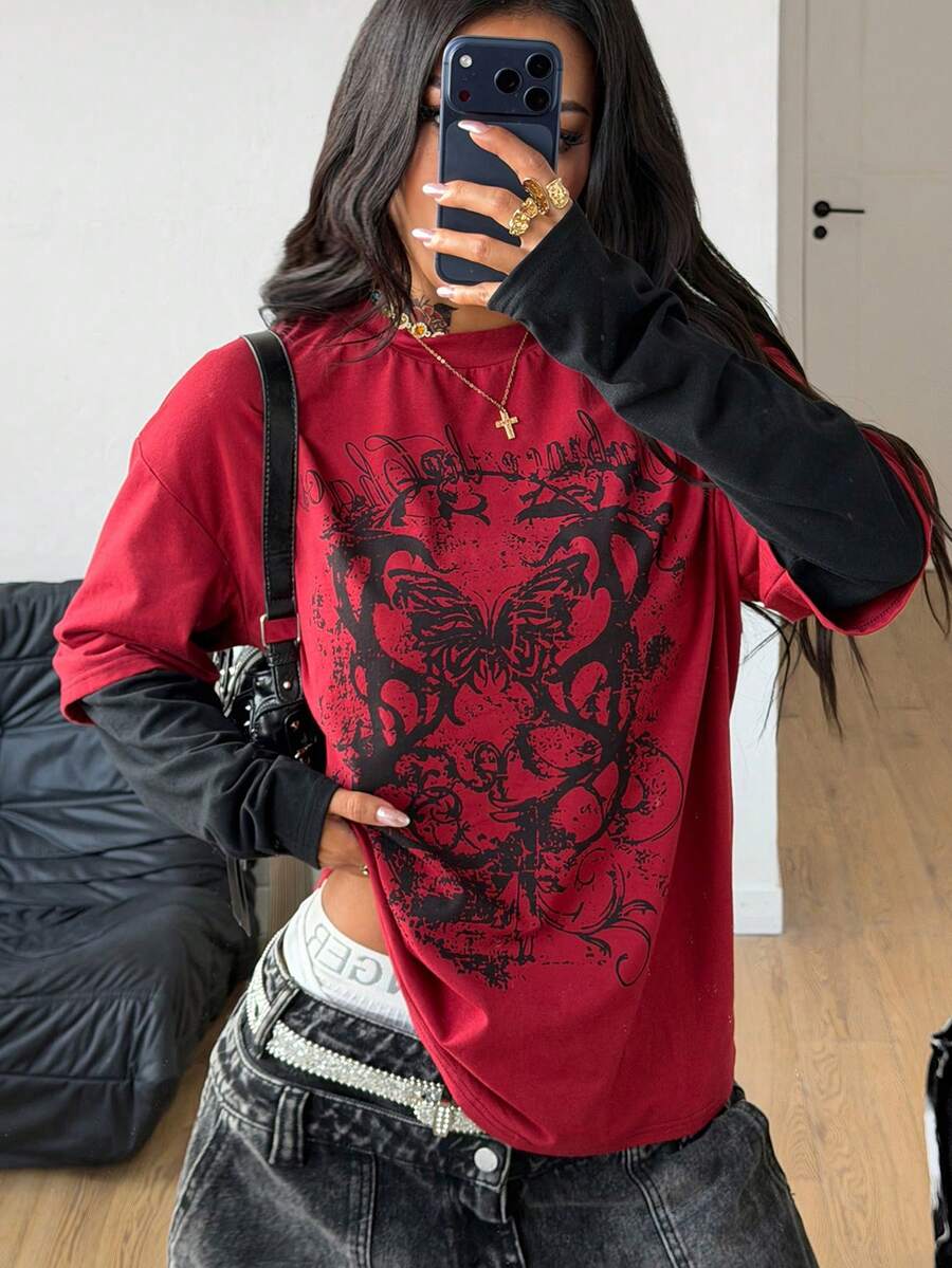 Women's casual graphic long sleeve t-shirt with a round neck, drop shoulder sleeves, and loose relaxed fit.