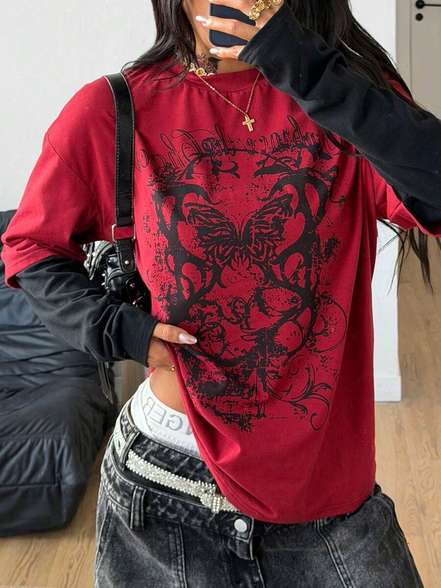 Women's casual graphic long sleeve t-shirt with a round neck, drop shoulder sleeves, and loose relaxed fit.