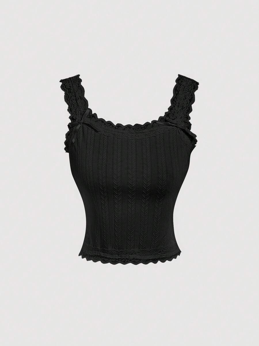 Black jacquard textured camisole top featuring contrast lace trim, bow decoration, scoop neck, and wide shoulder straps.