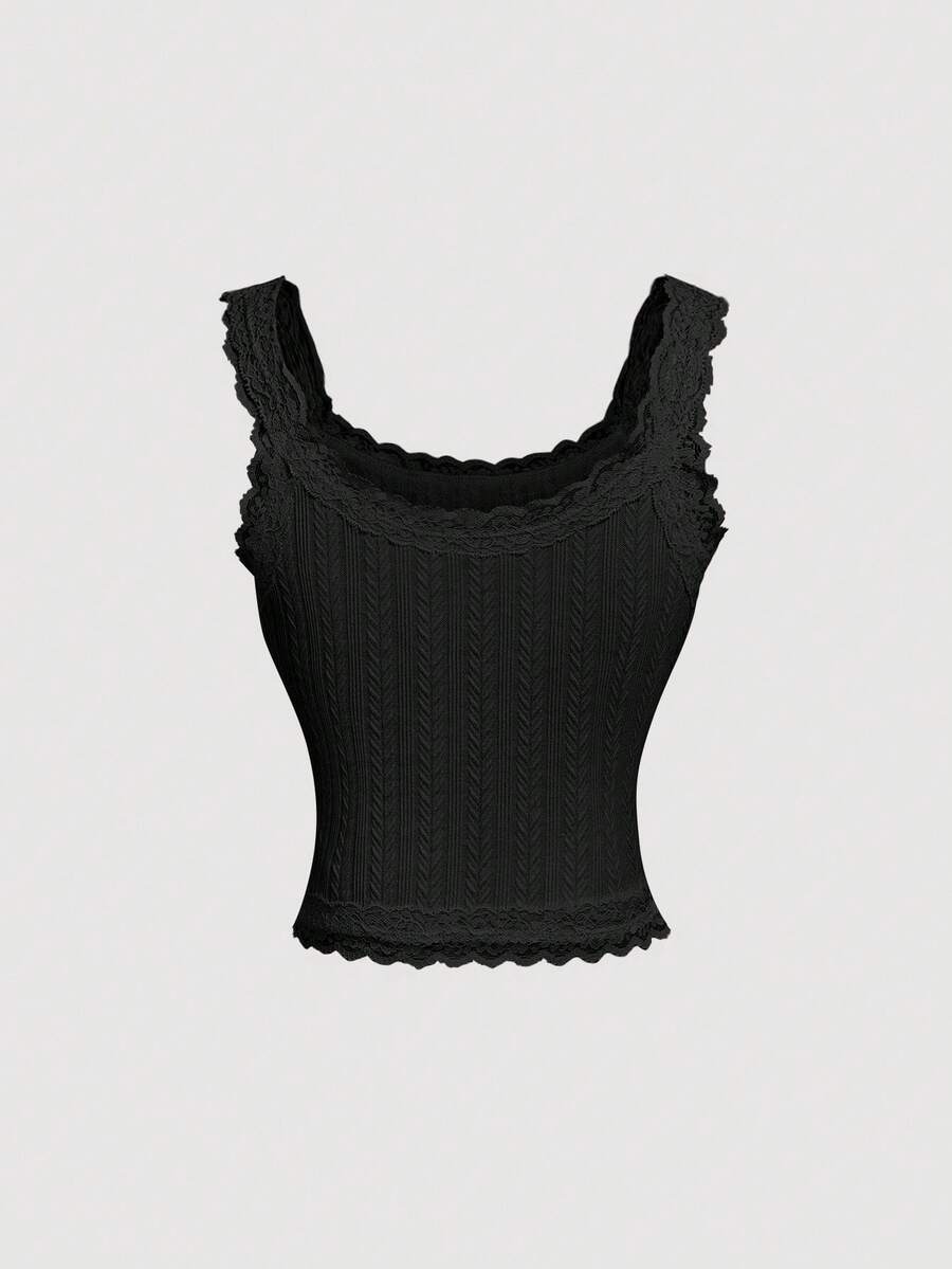 Black jacquard textured camisole top featuring contrast lace trim, bow decoration, scoop neck, and wide shoulder straps.