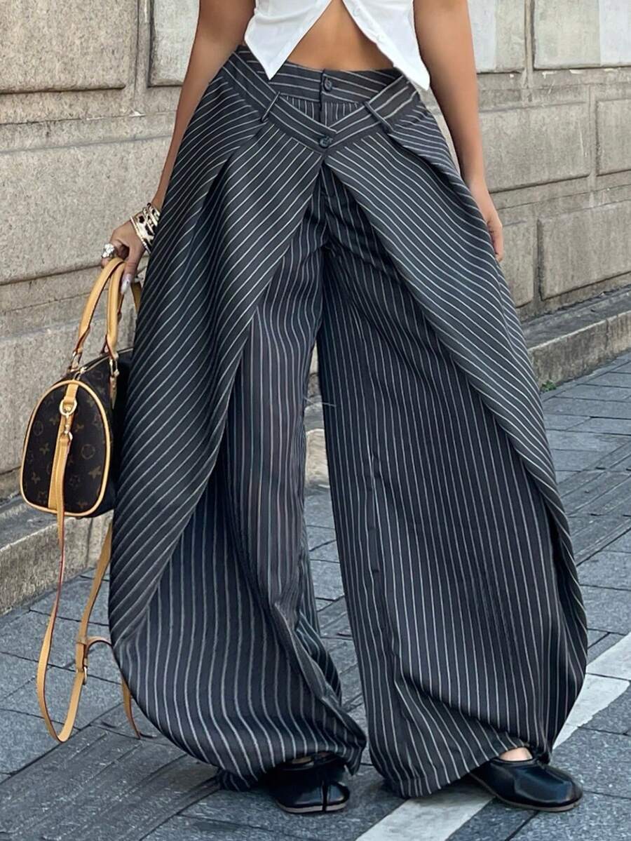 Women's loose fit pleated wide leg pants in royal blue pinstripe woven fabric with zipper fly closure.