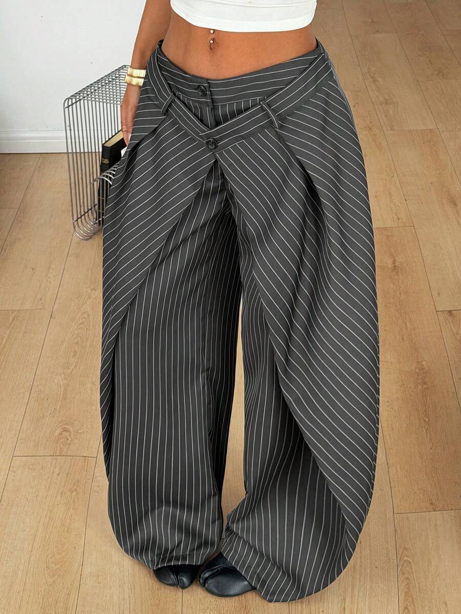 Women's loose fit pleated wide leg pants in royal blue pinstripe woven fabric with zipper fly closure.