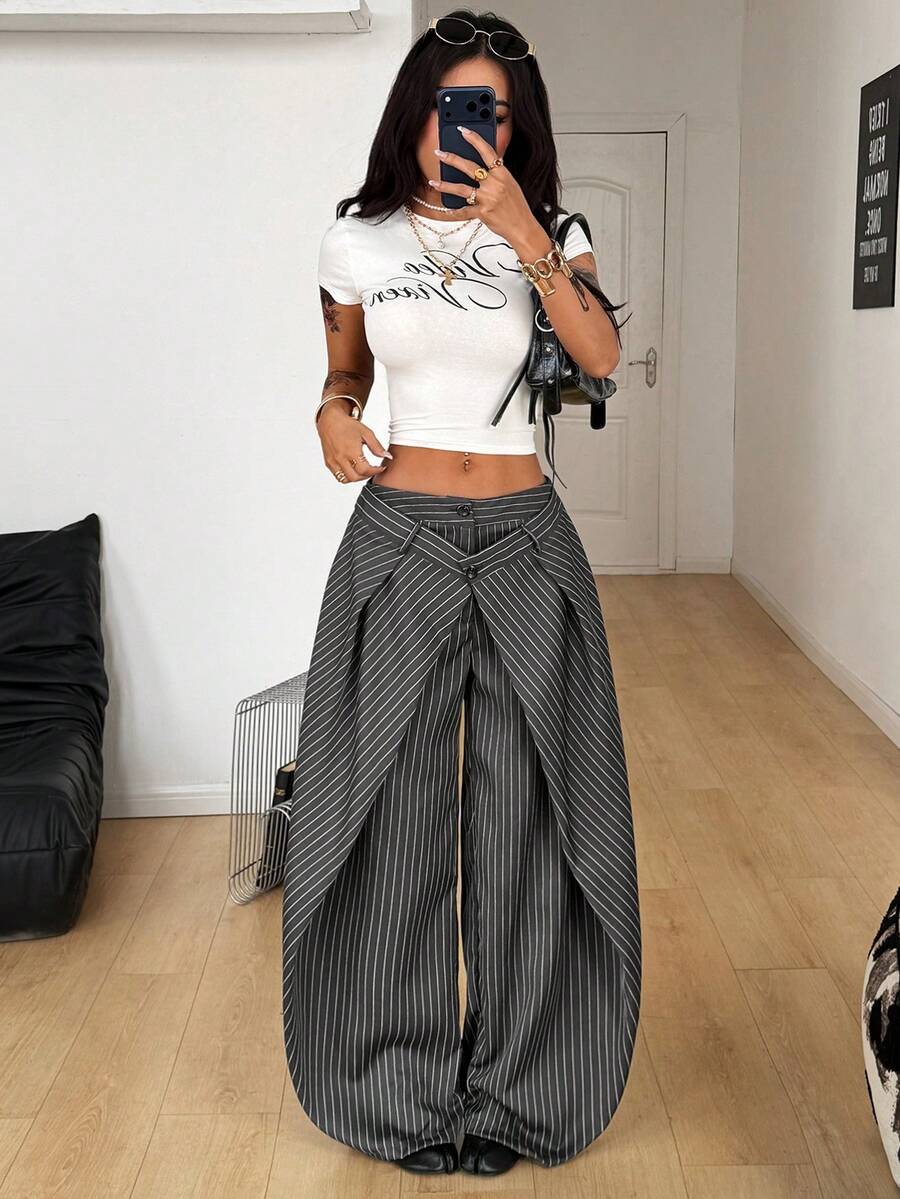 Women's loose fit pleated wide leg pants in royal blue pinstripe woven fabric with zipper fly closure.