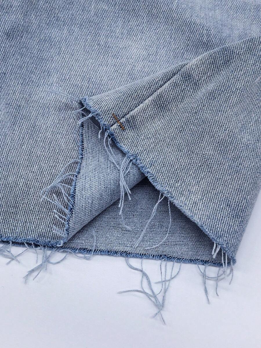 Y2K distressed mini skort with button and pocket details, natural mid waist, regular fit, and casual streetwear styling.