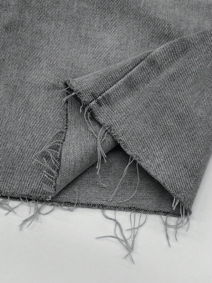 Y2K distressed mini skort with button and pocket details, natural mid waist, regular fit, and casual streetwear styling.
