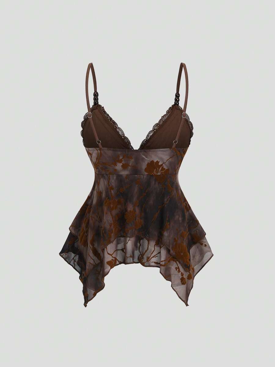 Women's black spaghetti strap tank top featuring contrast lace details, asymmetric ruffle hem, and slim fit design.