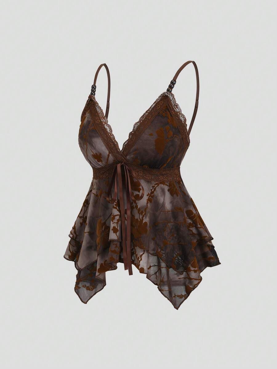 Women's black spaghetti strap tank top featuring contrast lace details, asymmetric ruffle hem, and slim fit design.