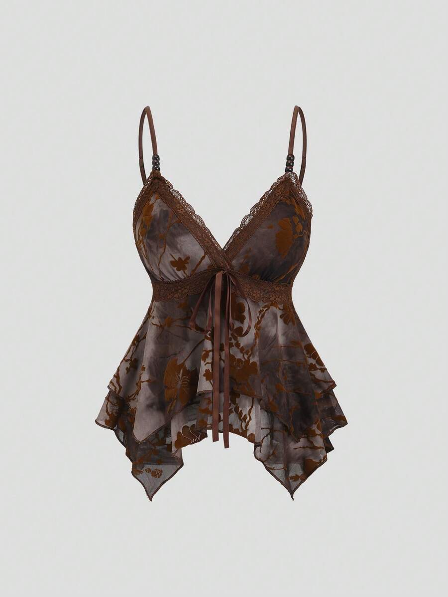 Women's black spaghetti strap tank top featuring contrast lace details, asymmetric ruffle hem, and slim fit design.