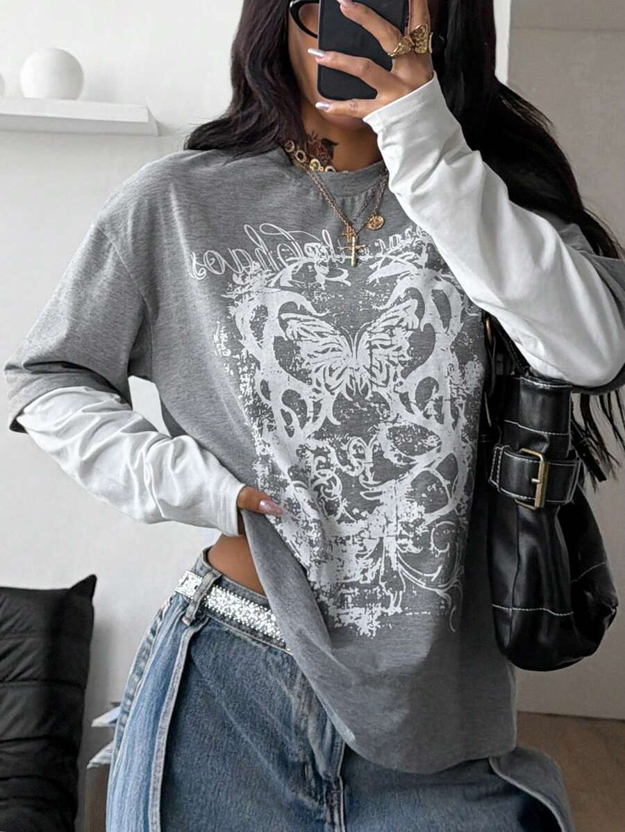 Women's casual graphic long sleeve t-shirt with a round neck, drop shoulder sleeves, and loose relaxed fit.