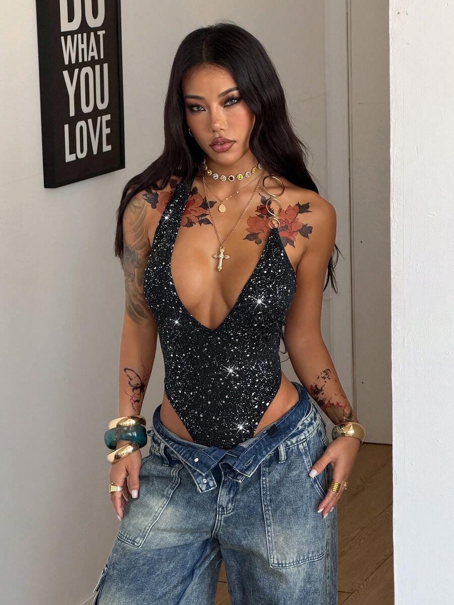 Women's black deep V-neck sleeveless bodysuit featuring shiny contrast sequin details and an open backless cut.