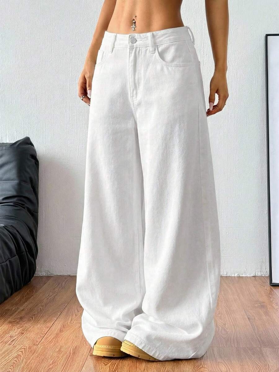 Women's casual loose fit wide leg denim jeans with functional pockets and low waist design.