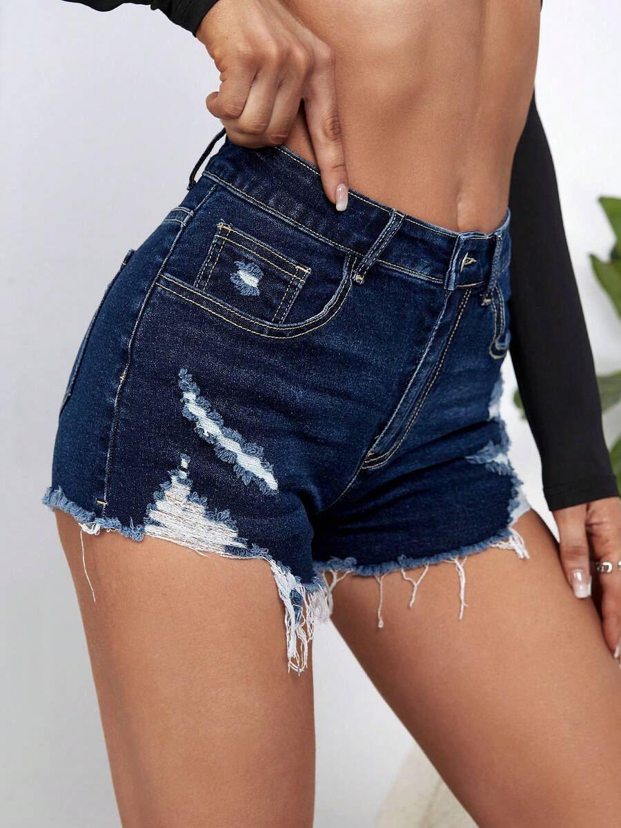 Women's solid color shorts with zipper fly, button closure, pockets, ripped details, and raw hem in a casual straight-leg short length
