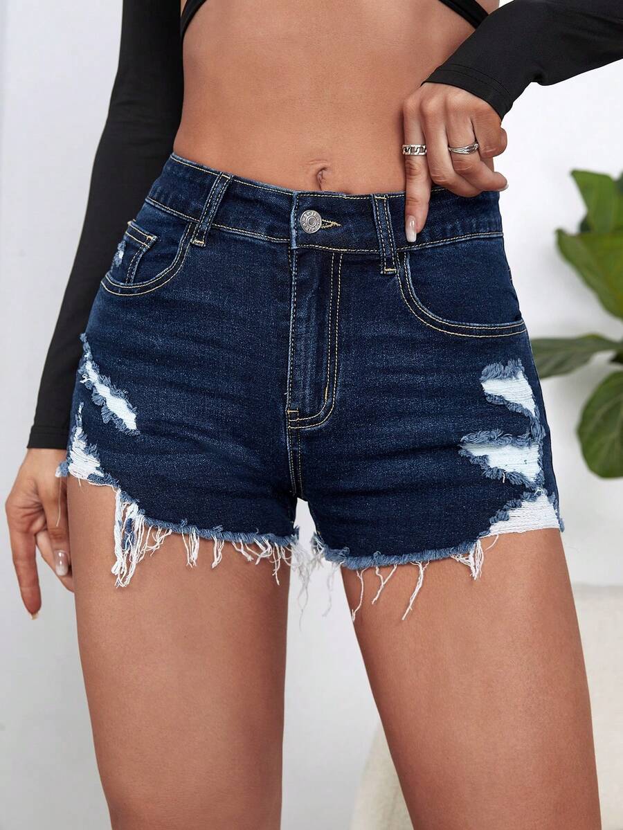 Women's solid color shorts with zipper fly, button closure, pockets, ripped details, and raw hem in a casual straight-leg short length