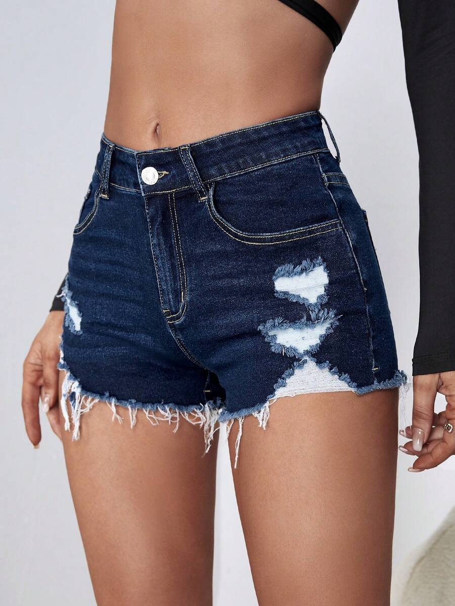 Women's solid color shorts with zipper fly, button closure, pockets, ripped details, and raw hem in a casual straight-leg short length