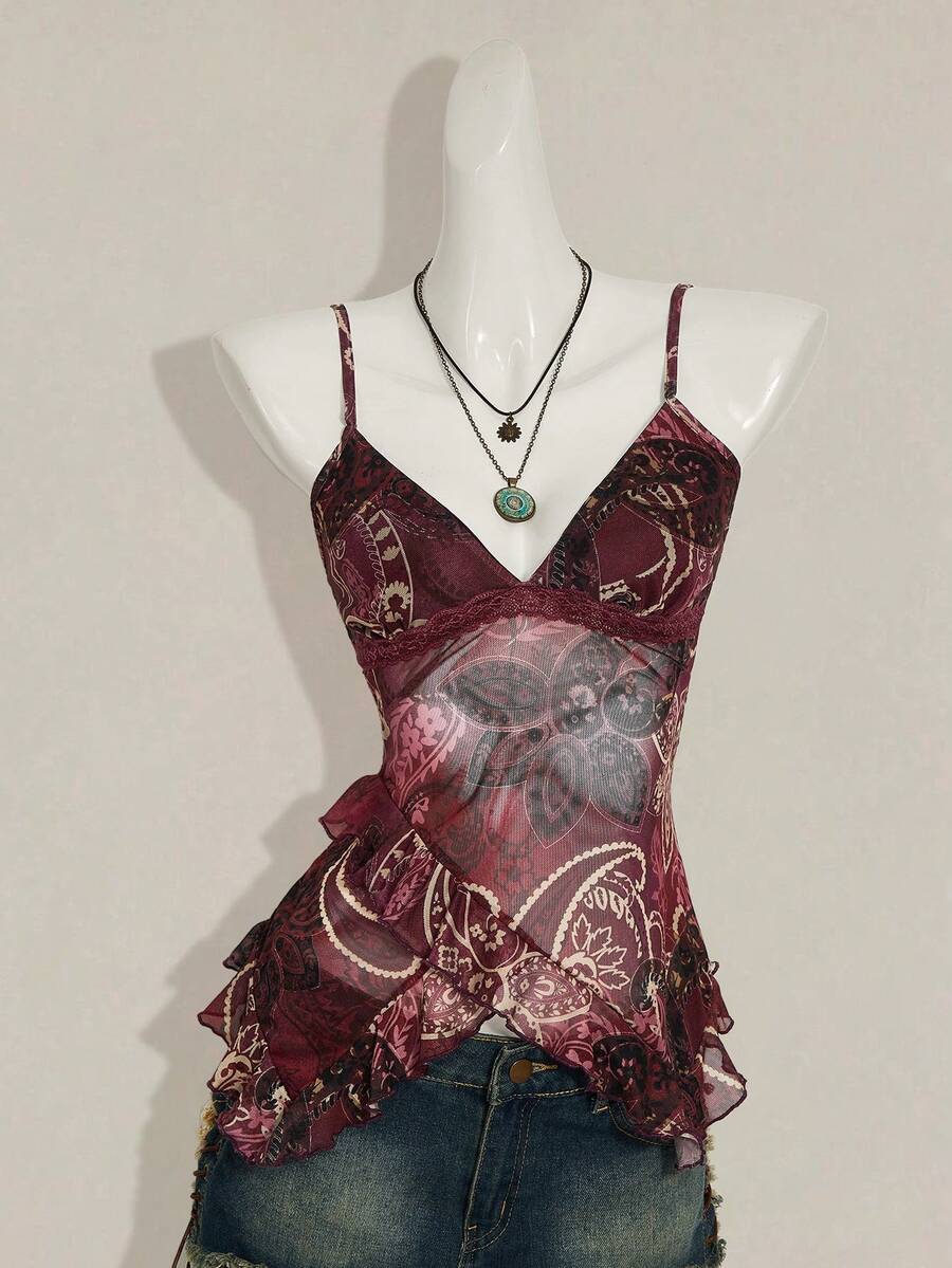 Women's graphic print camisole top featuring thin spaghetti straps, a backless cut, and an asymmetrical hem.