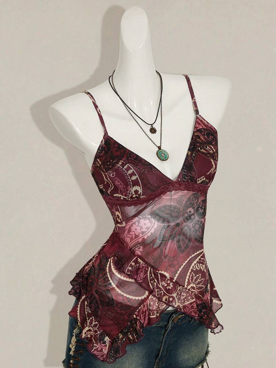 Women's graphic print camisole top featuring thin spaghetti straps, a backless cut, and an asymmetrical hem.