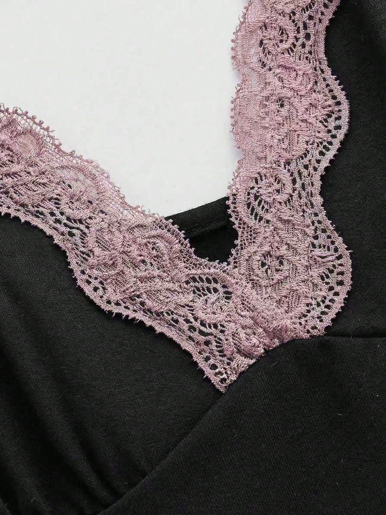 Women's spaghetti strap camisole with contrast lace patchwork, slim fit silhouette, plain design, and flared hem.