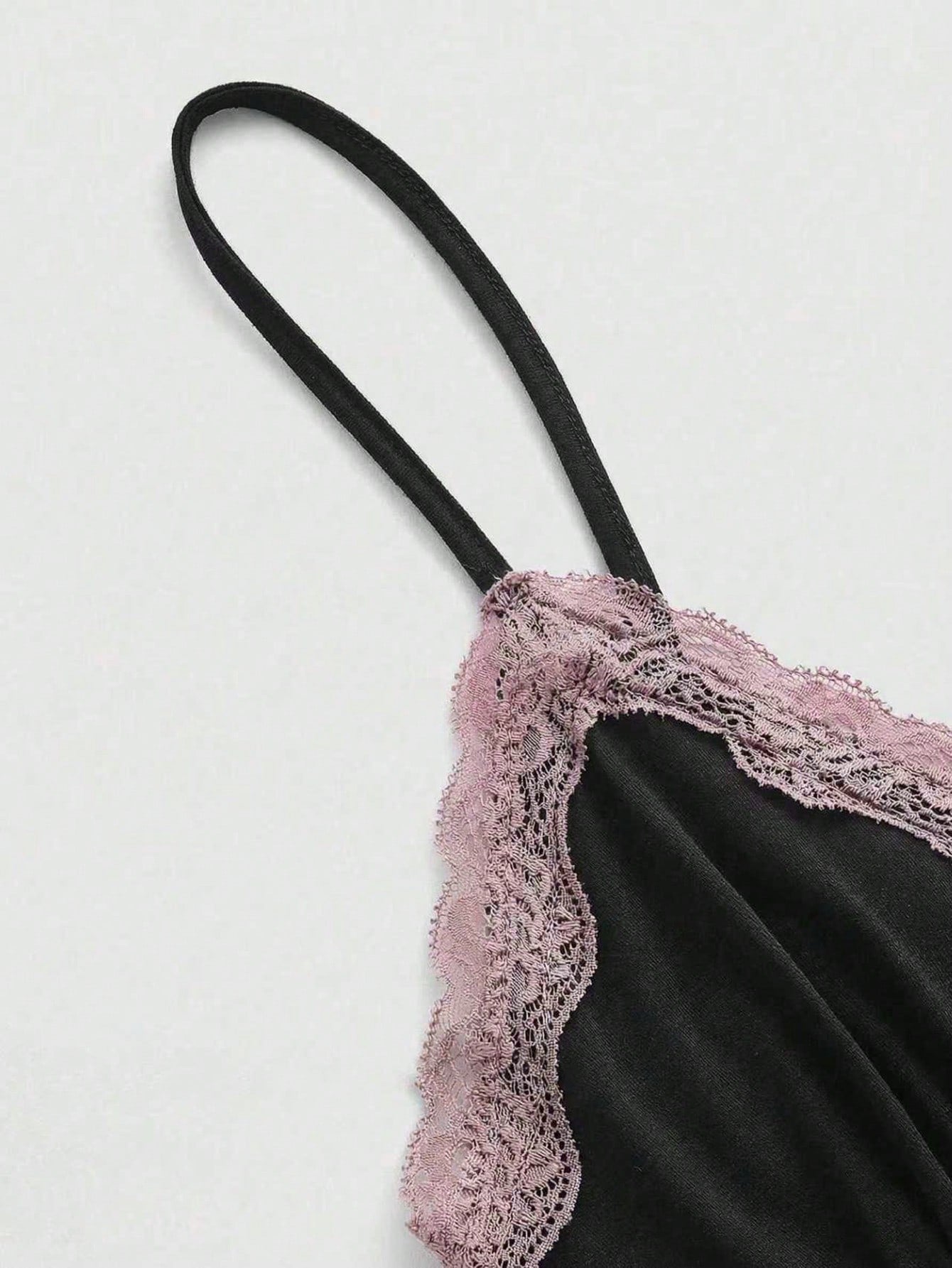 Women's spaghetti strap camisole with contrast lace patchwork, slim fit silhouette, plain design, and flared hem.