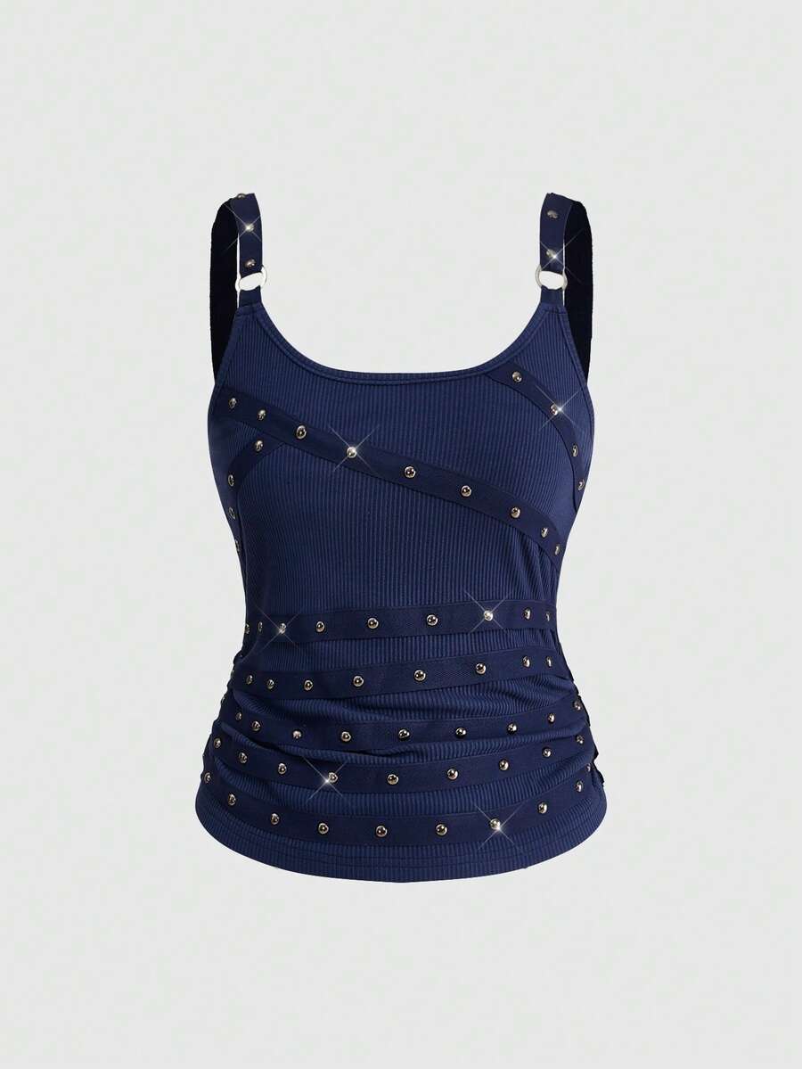 Women's wide-strap cami top featuring a grunge punk design with cut-out details, rhinestone embellishments, and grommet eyelets.