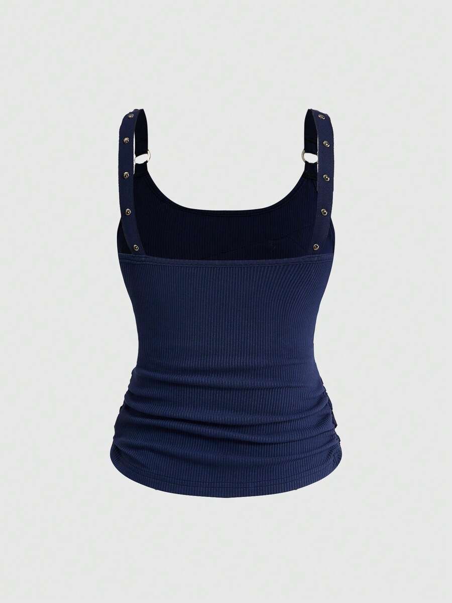 Women's wide-strap cami top featuring a grunge punk design with cut-out details, rhinestone embellishments, and grommet eyelets.