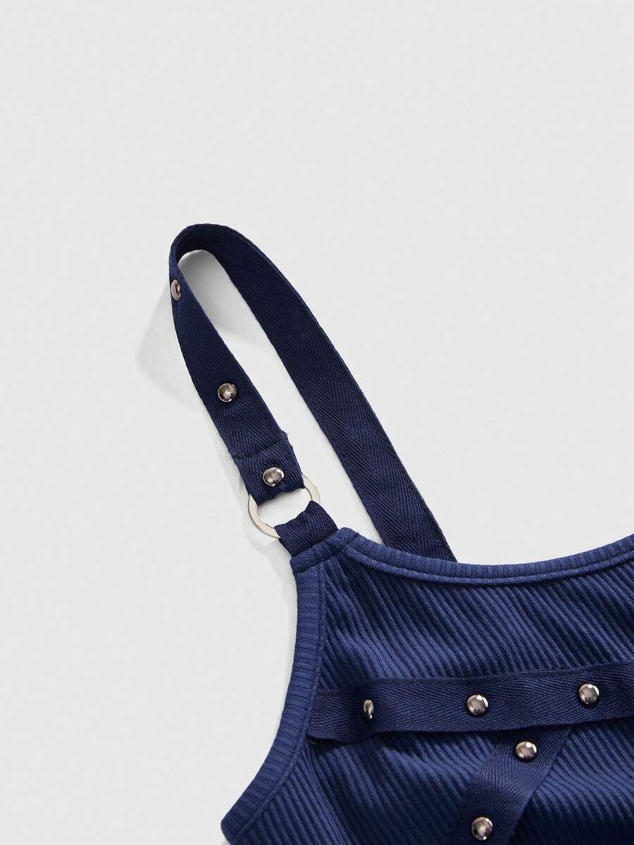 Women's wide-strap cami top featuring a grunge punk design with cut-out details, rhinestone embellishments, and grommet eyelets.