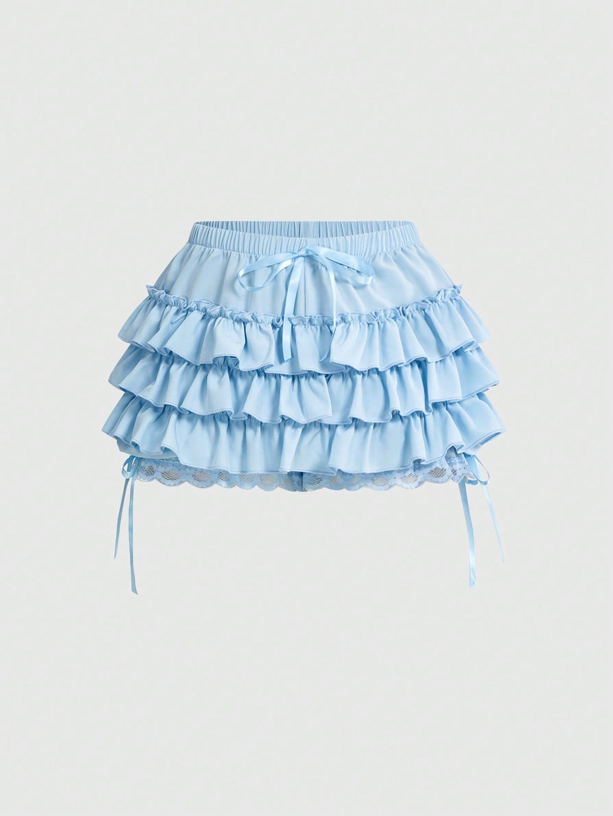 Women's tiered ruffle skort shorts featuring an elastic mid waist with front tie knot detail in woven fabric.
