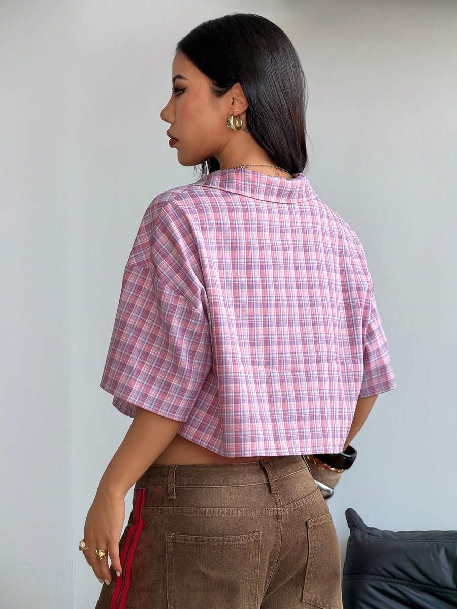 Women's plaid crop shirt with button front, chest pocket, short sleeves, and loose casual fit.