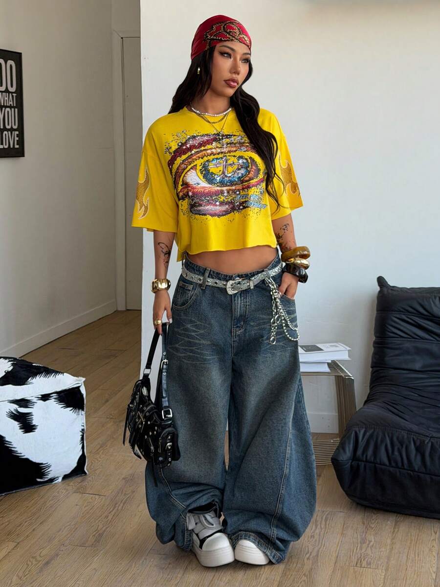 Women's oversized graphic crop t-shirt with short drop shoulder sleeves and round neckline in a streetwear style.