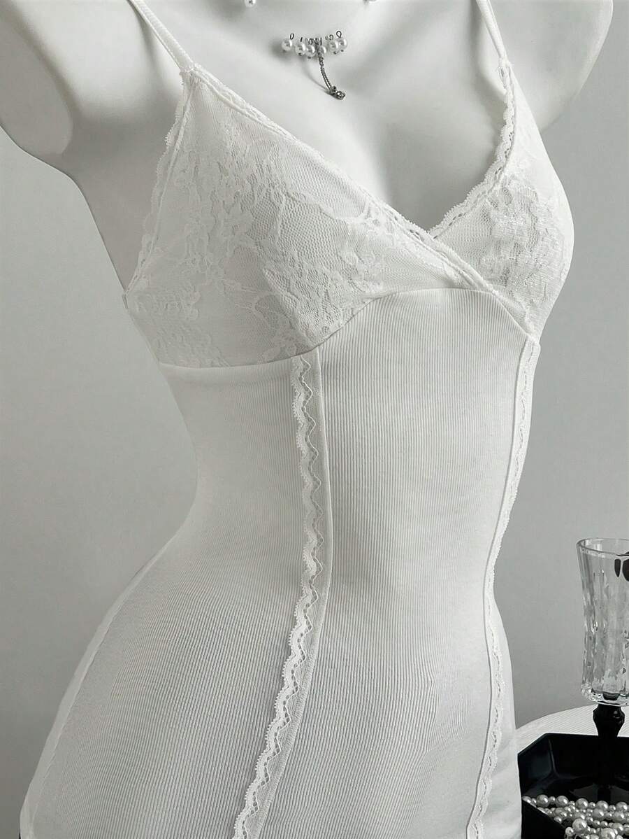 Women's slim fit backless cami tank top with contrast lace patchwork details, spaghetti straps, and high-stretch knitted ribbed fabric.
