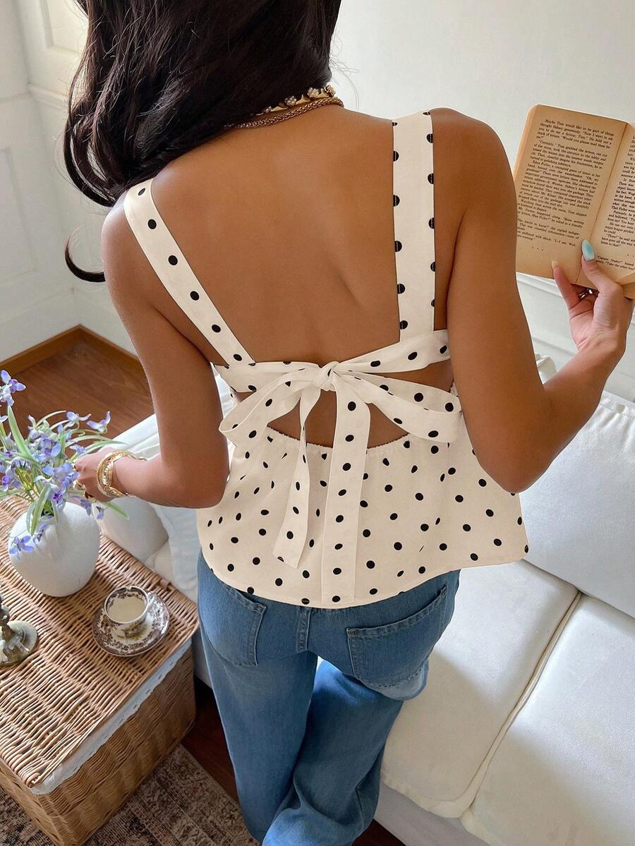 Women's casual polka dot tank top with tie-front knot, strap neckline, backless design, and ruffle flared hem