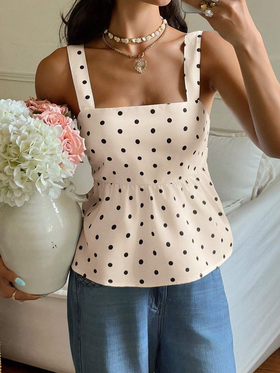 Women's casual polka dot tank top with tie-front knot, strap neckline, backless design, and ruffle flared hem
