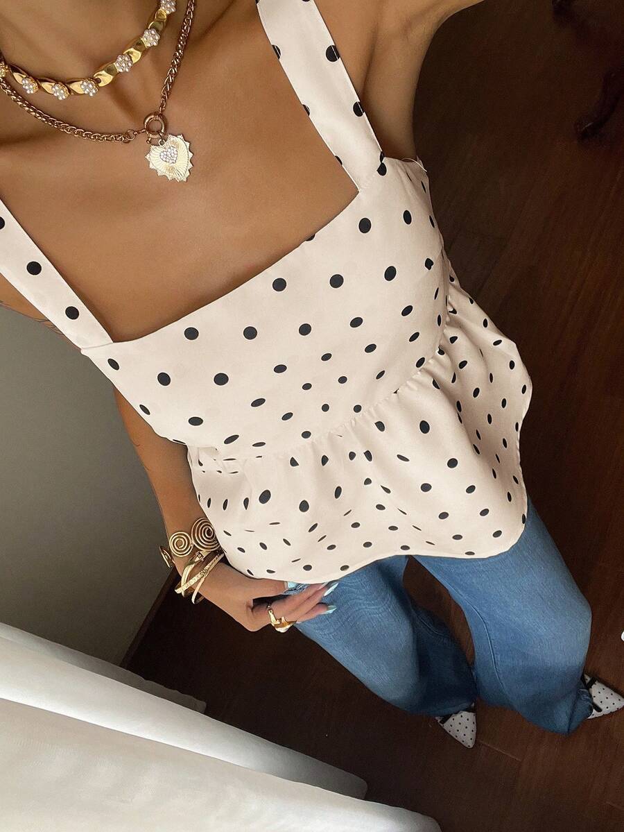 Women's casual polka dot tank top with tie-front knot, strap neckline, backless design, and ruffle flared hem