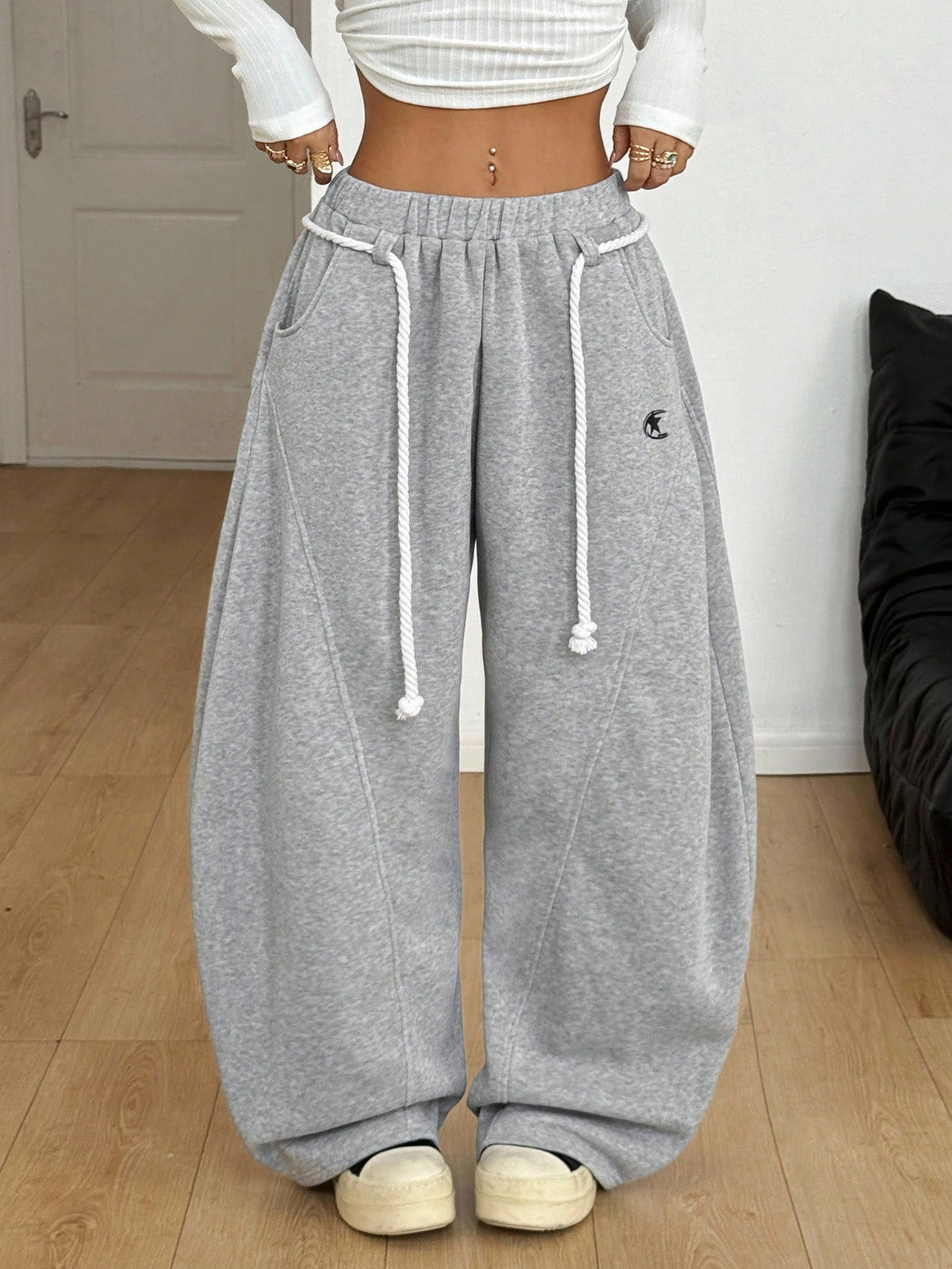 Plus size unisex baggy wide leg sweatpants in black with high elastic drawstring waist and side pockets