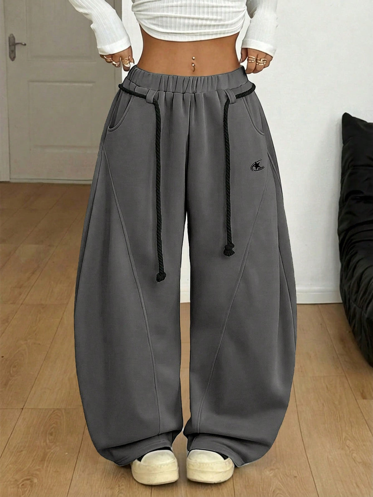Women's casual grey plaid sweatpants featuring an elastic drawstring waistband, side pockets, and a relaxed loose fit.