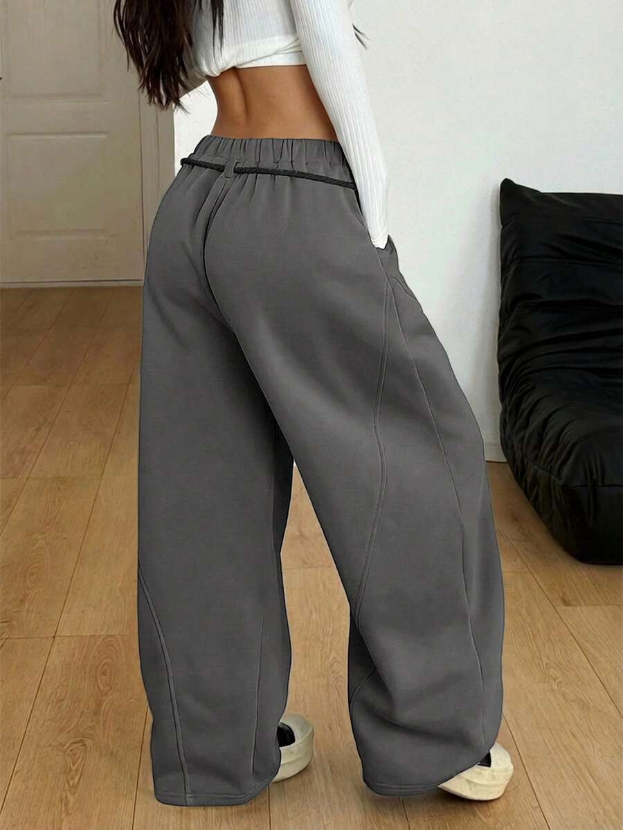 Women's casual grey plaid sweatpants featuring an elastic drawstring waistband, side pockets, and a relaxed loose fit.