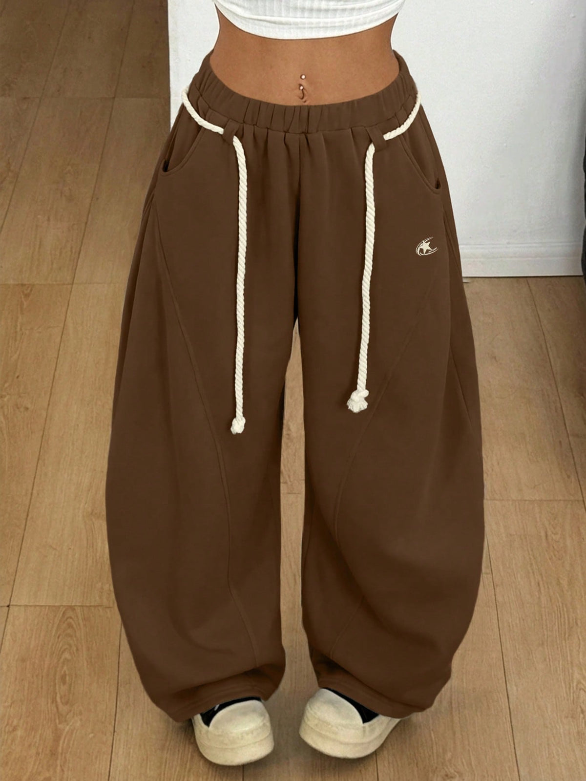 Women's casual grey plaid sweatpants featuring an elastic drawstring waistband, side pockets, and a relaxed loose fit.