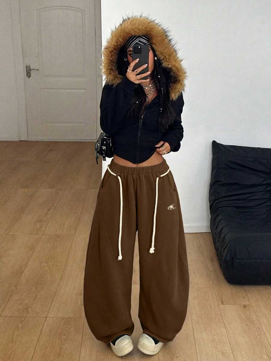 Women's casual grey plaid sweatpants featuring an elastic drawstring waistband, side pockets, and a relaxed loose fit.