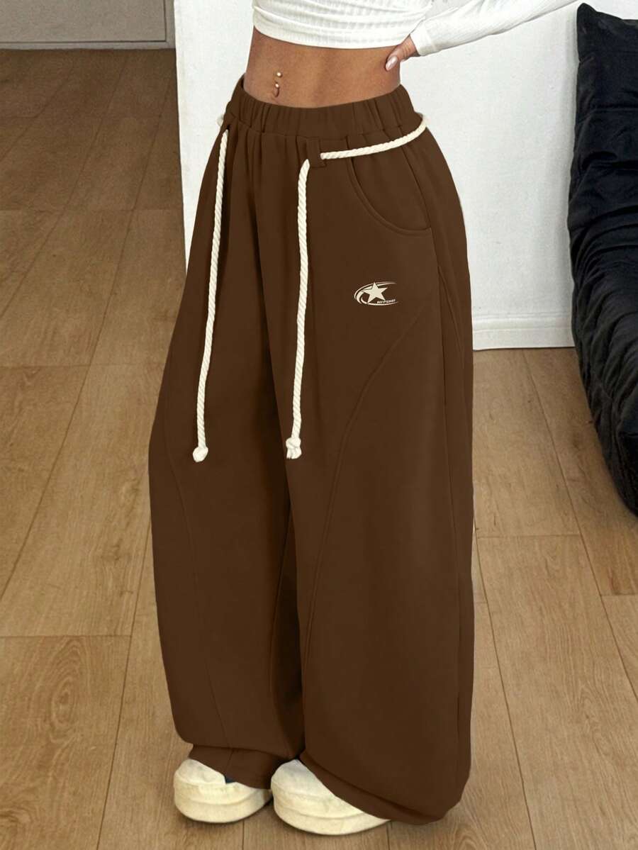 Women's casual grey plaid sweatpants featuring an elastic drawstring waistband, side pockets, and a relaxed loose fit.