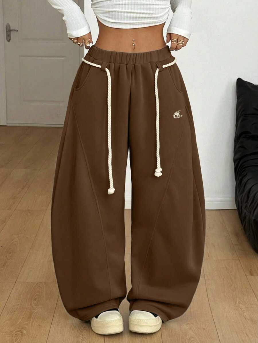 Women's casual grey plaid sweatpants featuring an elastic drawstring waistband, side pockets, and a relaxed loose fit.
